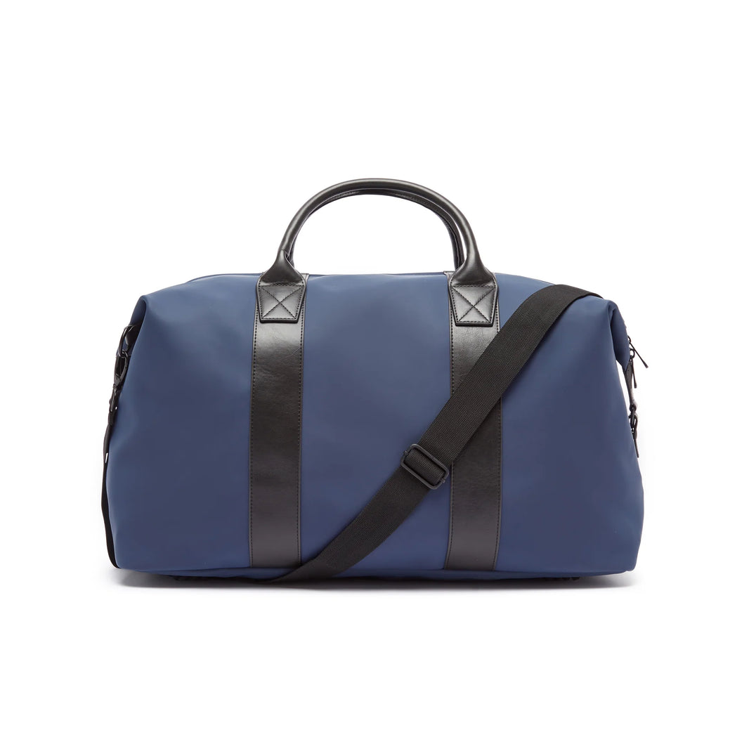 Blue duffel bag with black straps on a white background