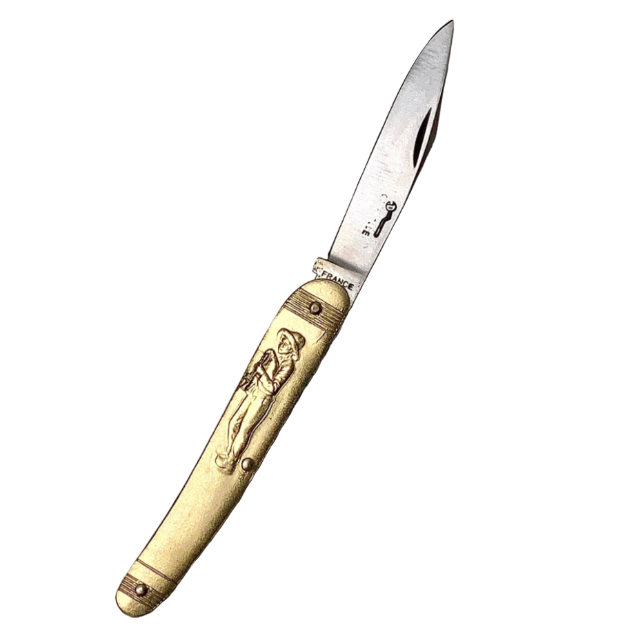 Decorative knife with gold handle and engraved design on a white background