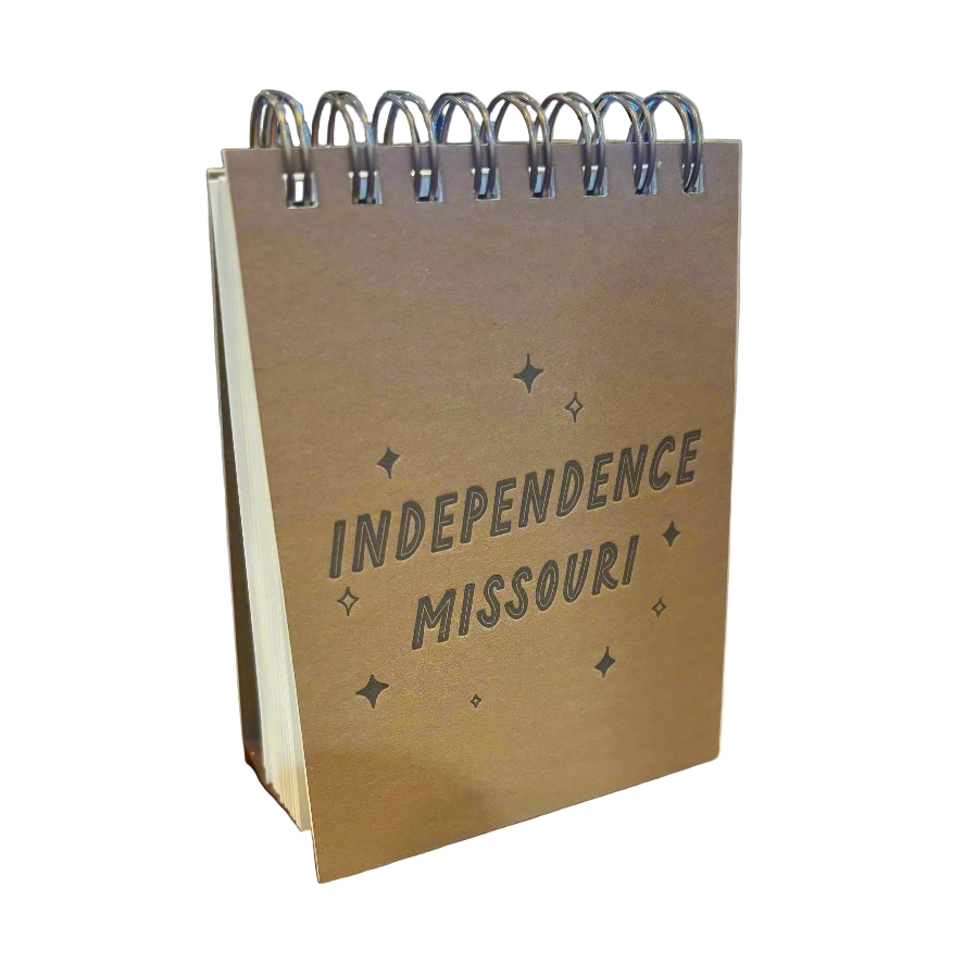 Small spiral-bound notebook with 'Independence Missouri' text on a white background