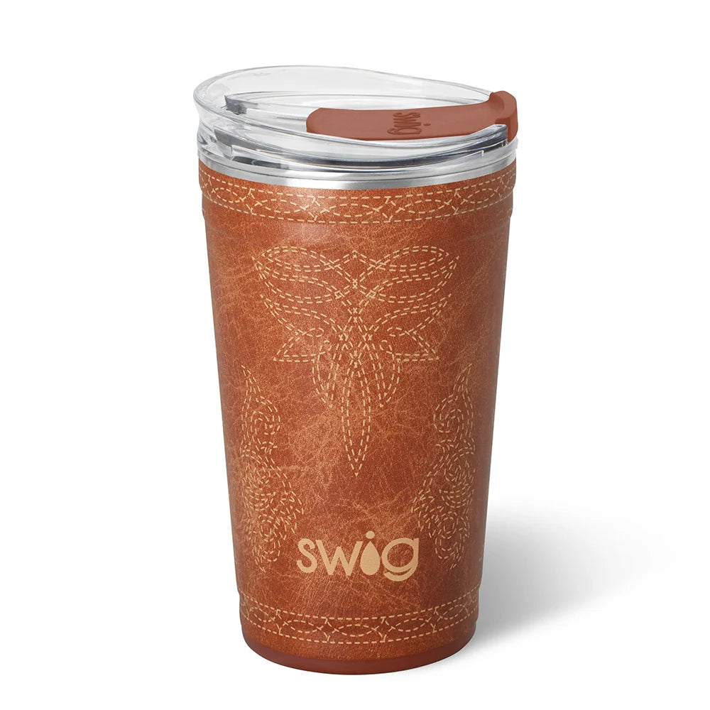 A brown insulated tumbler with a faux-leather western-style stitched pattern and the brand name 'swig' printed near the bottom. It is shown with a clear lid and brown flip-straw cover on a white background.