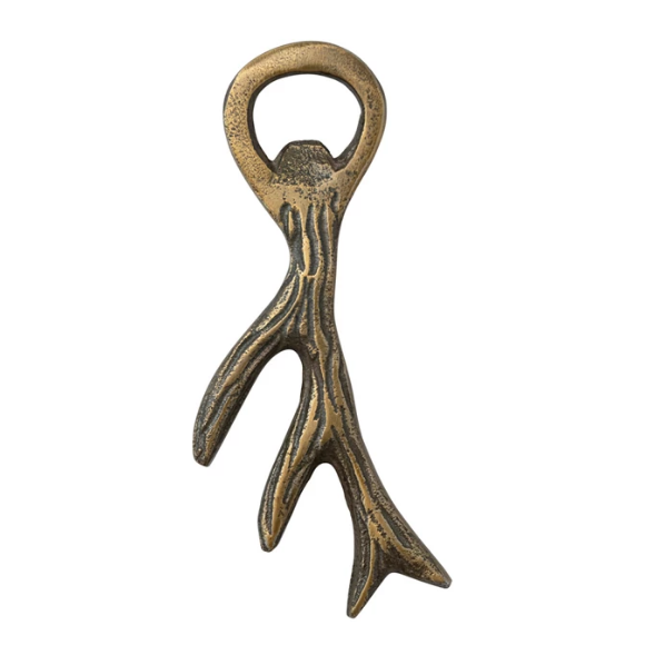 Decorative bottle opener with antler design on a white background