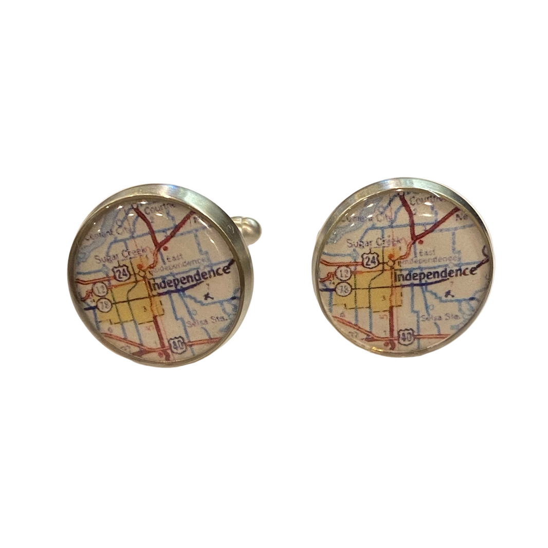 Independence map-themed cufflinks on a white background