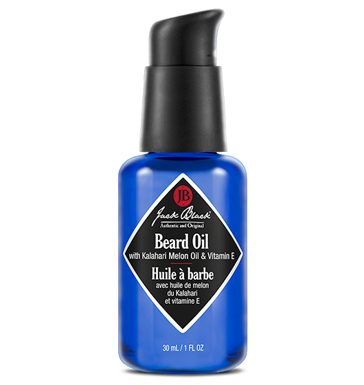 A pump bottle of Jack Black Beard Oil with a label indicating it contains Kalahari Melon Oil and Marula Oil among other ingredients.