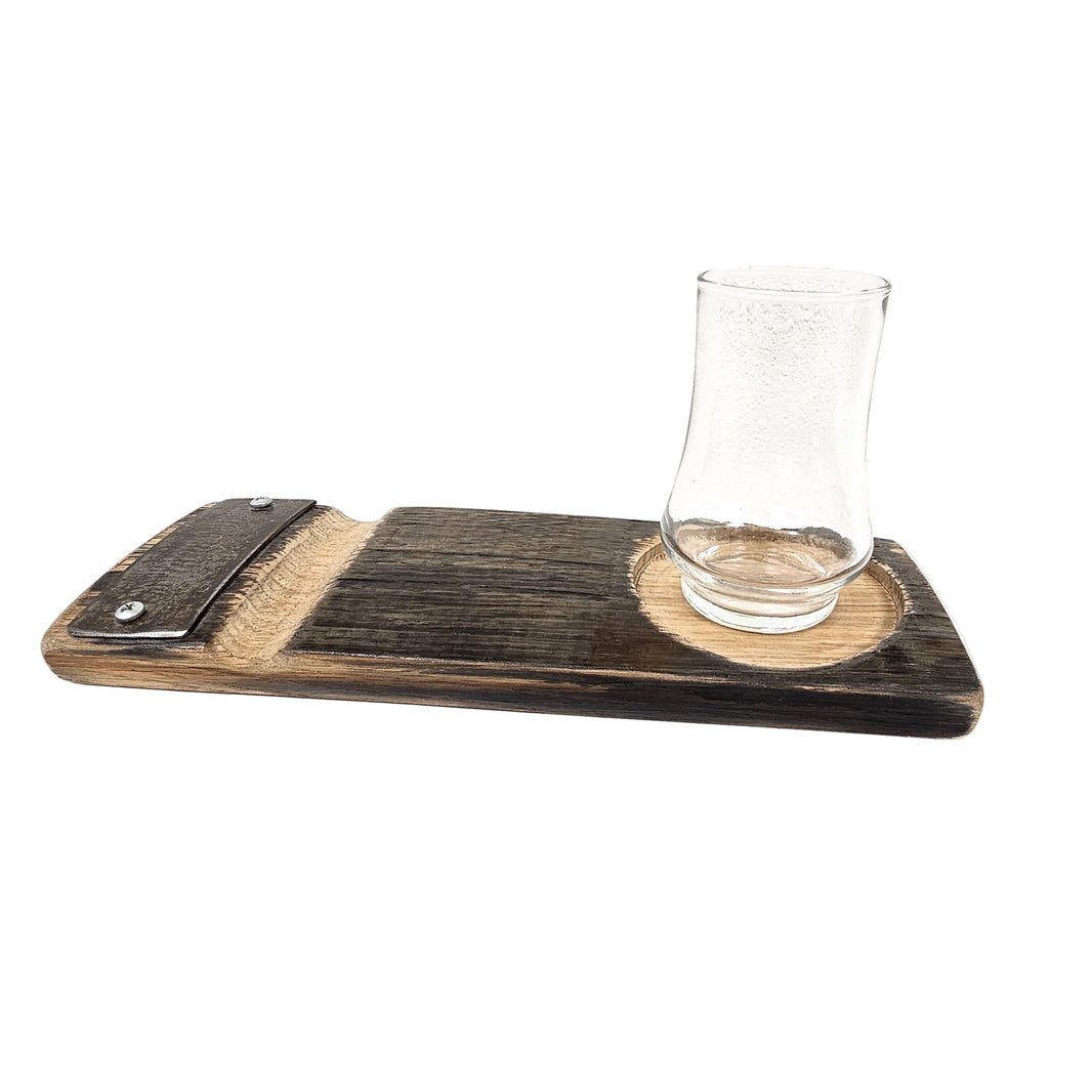 A wooden cigar tray made from upcycled whiskey barrel staves, with a place to rest a cigar, and a glass resting on top.