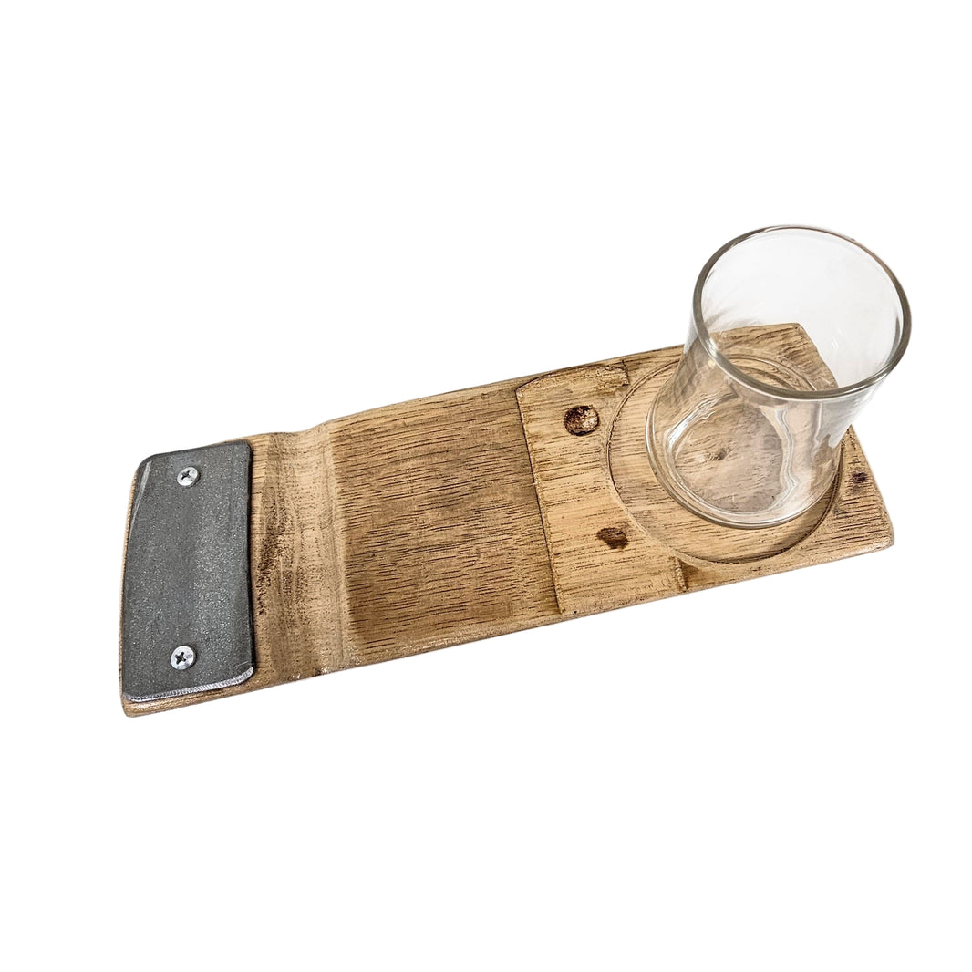 Wooden cigar tray with a glass on a white surface