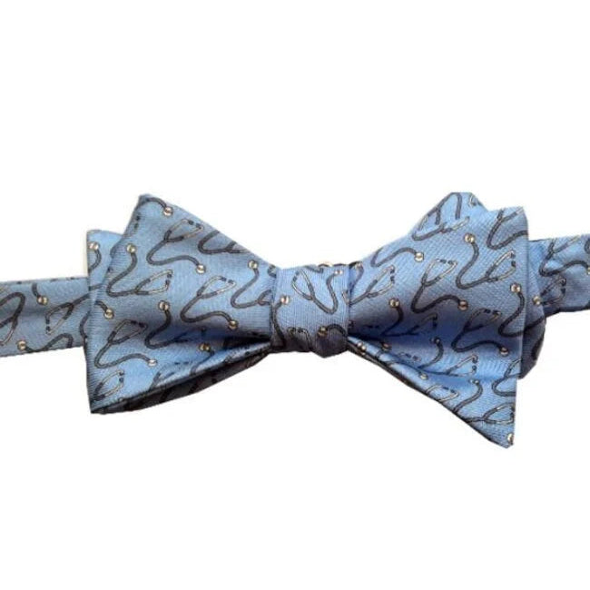 Blue bow tie with a stethoscope pattern on a white background
