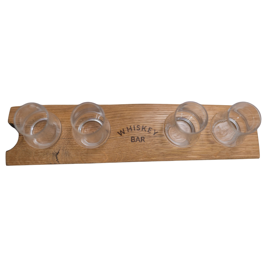 Wooden whiskey glass holder with four clear glasses on a white background