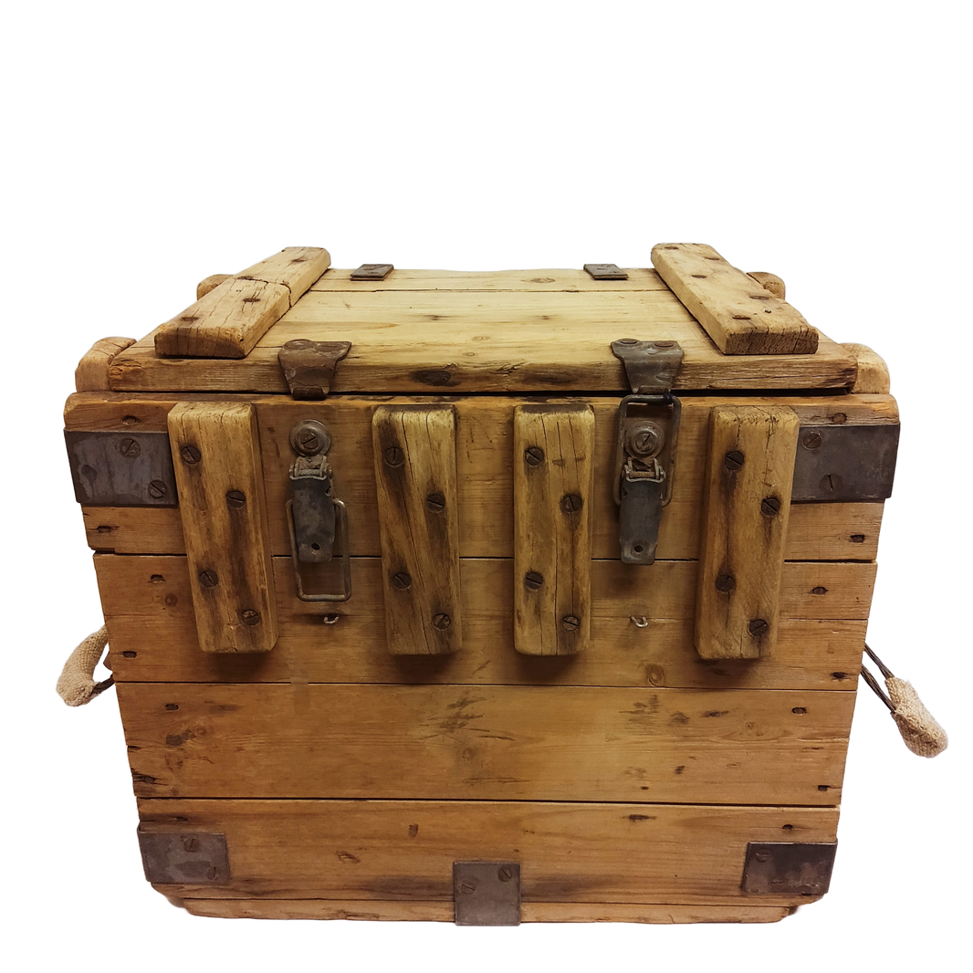 A weathered wooden wine storage crate with a hinged lid and metal accents, featuring two loop handles on the sides.