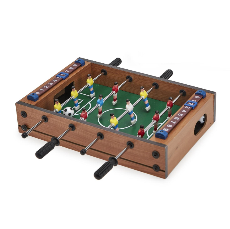 A miniature soccer foosball game set with colorful figures on a green playing surface, surrounded by a brown wooden frame, designed for tabletop play.