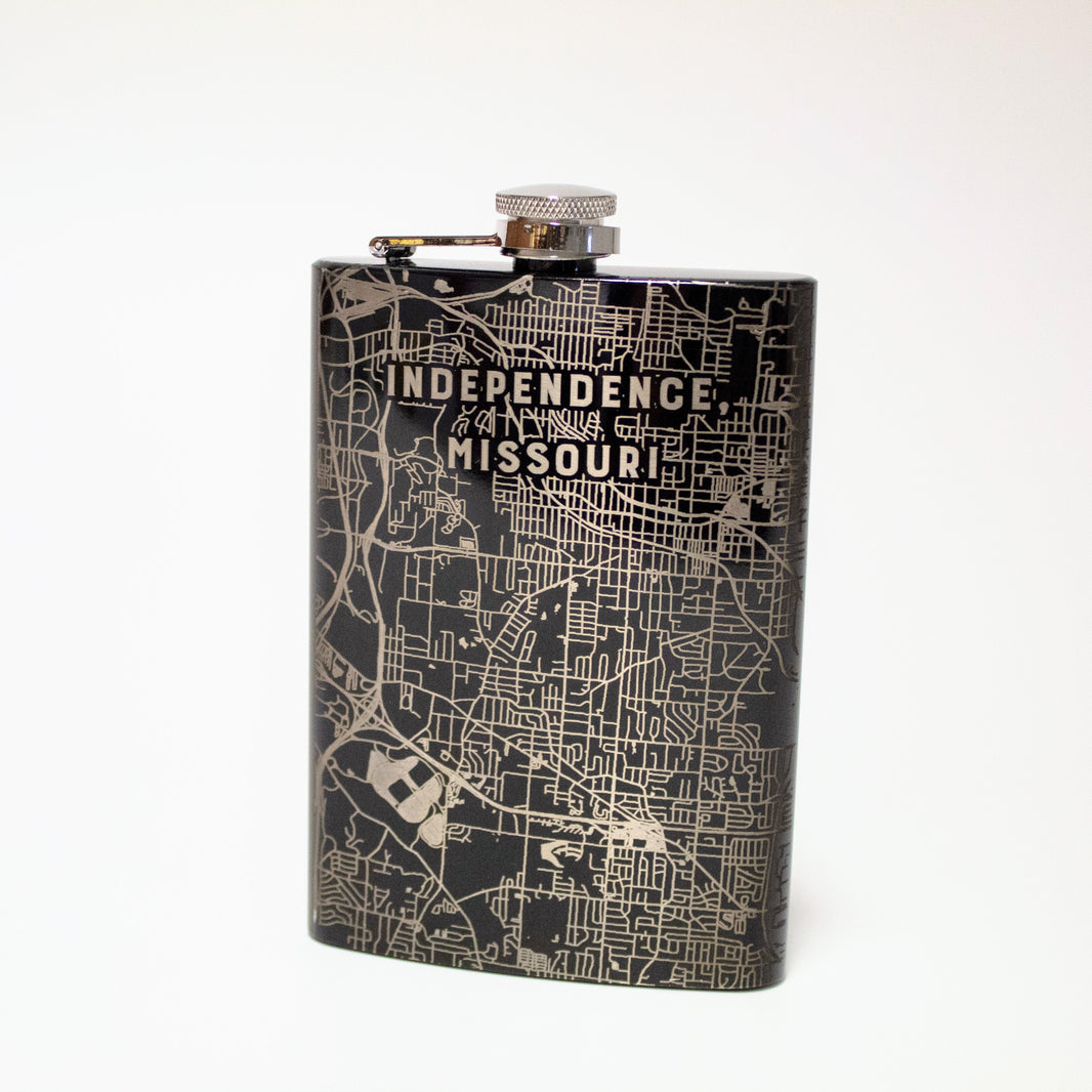 A black and silver flask with an etched map of Independence, Missouri.