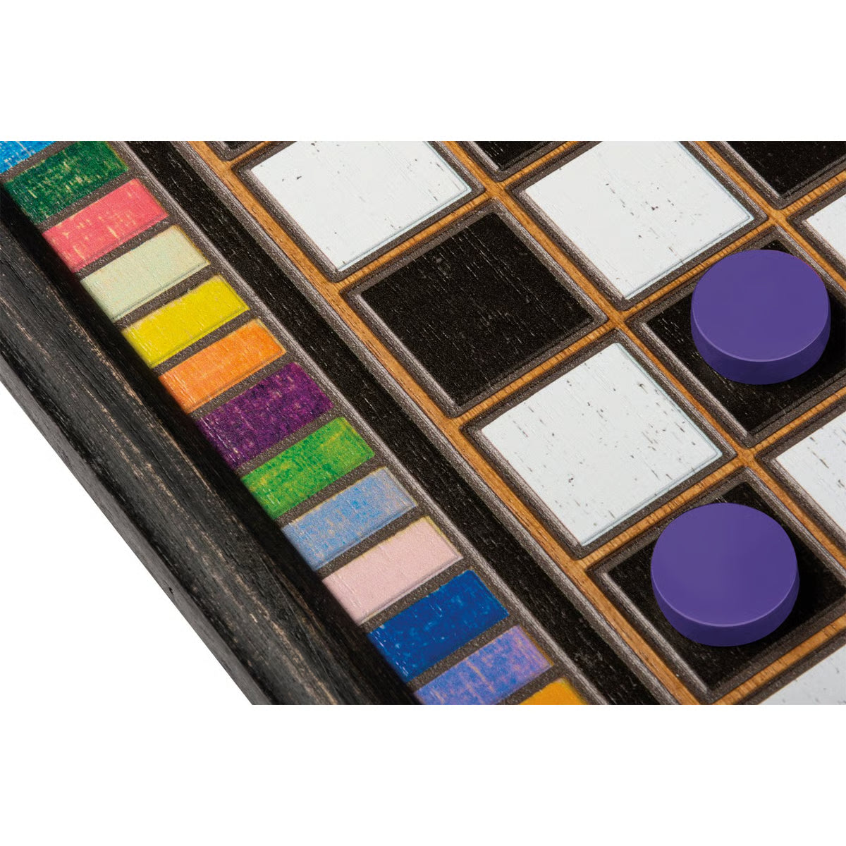 A close up of the colorful border of a wooden checkerboard game with two purple pieces on the board.
