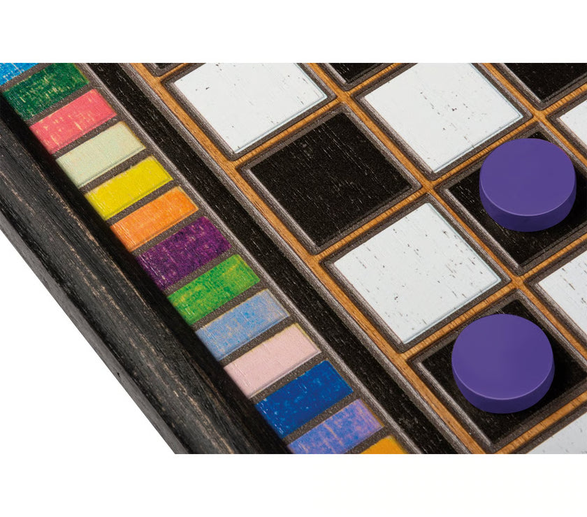 A close up of the colorful border of a wooden checkerboard game with two purple pieces on the board.