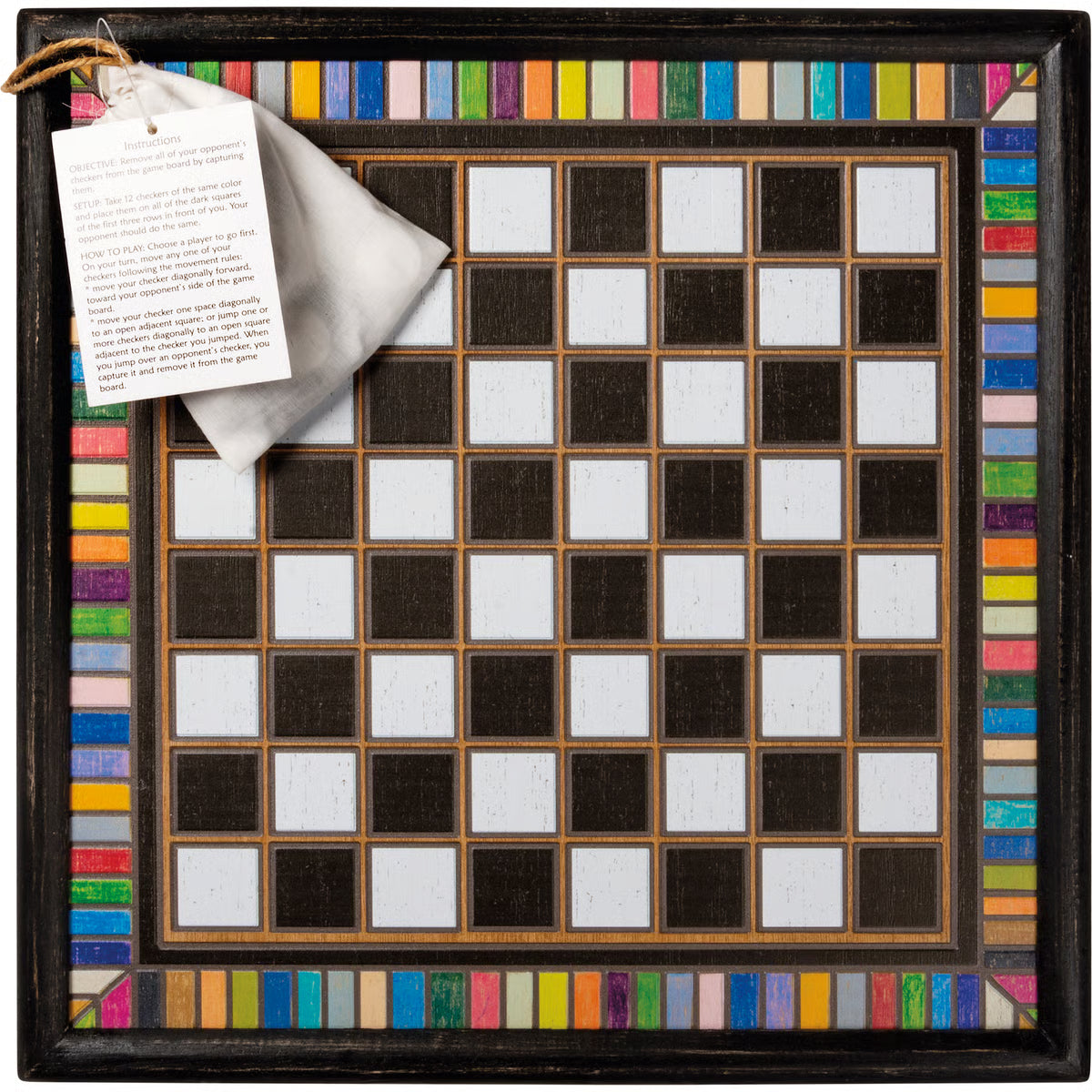 Checkered board with colorful border and bag with pieces and instruction paper attached.