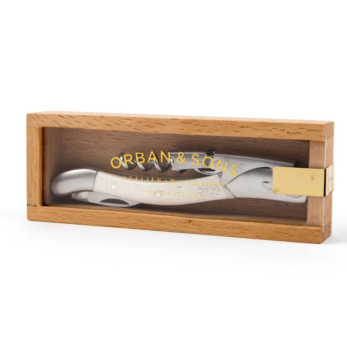 Corkscrew, knife, and bottle opener tool with bone handle in wooden box with an acrylic lid that says "Orban & Sons"