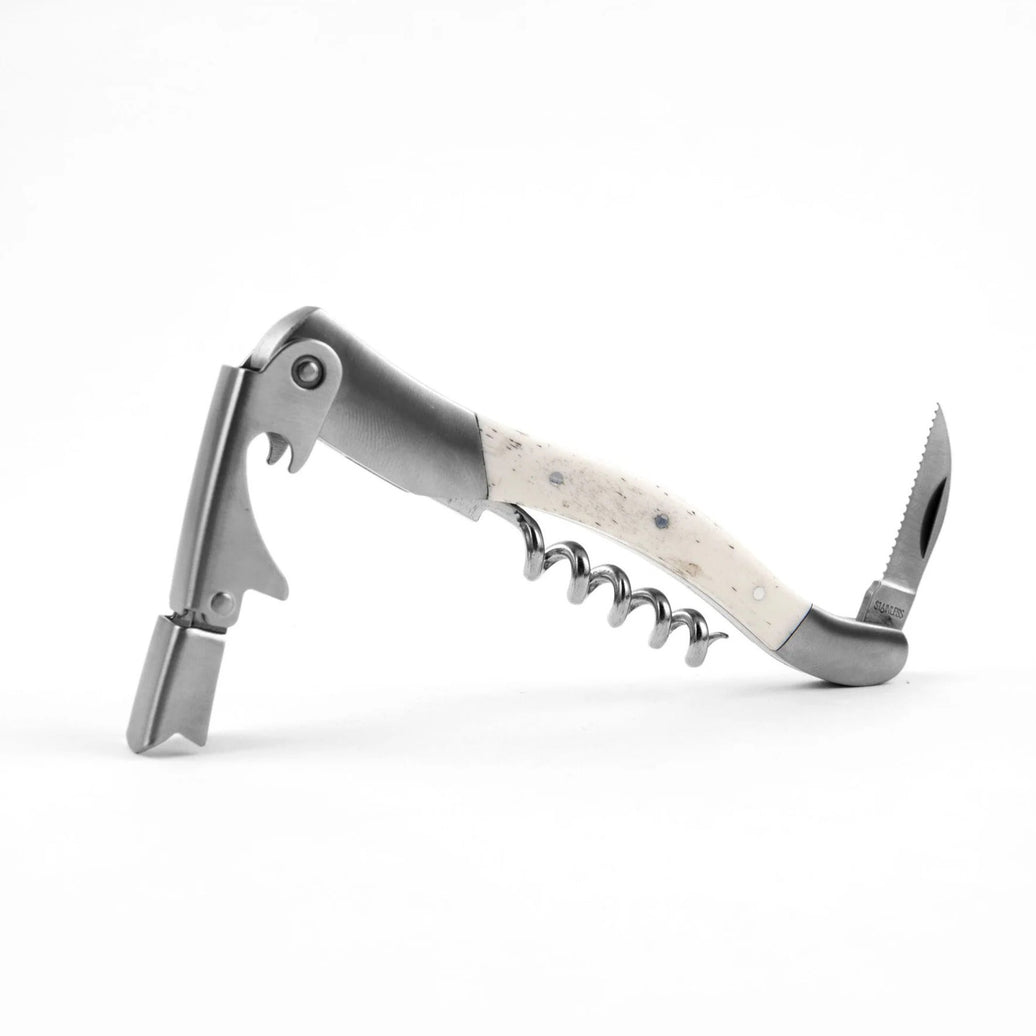Corkscrew, knife, and bottle opener tool with bone handle.