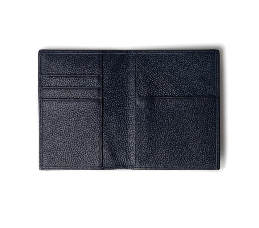 Blue leather passport wallet on a white background