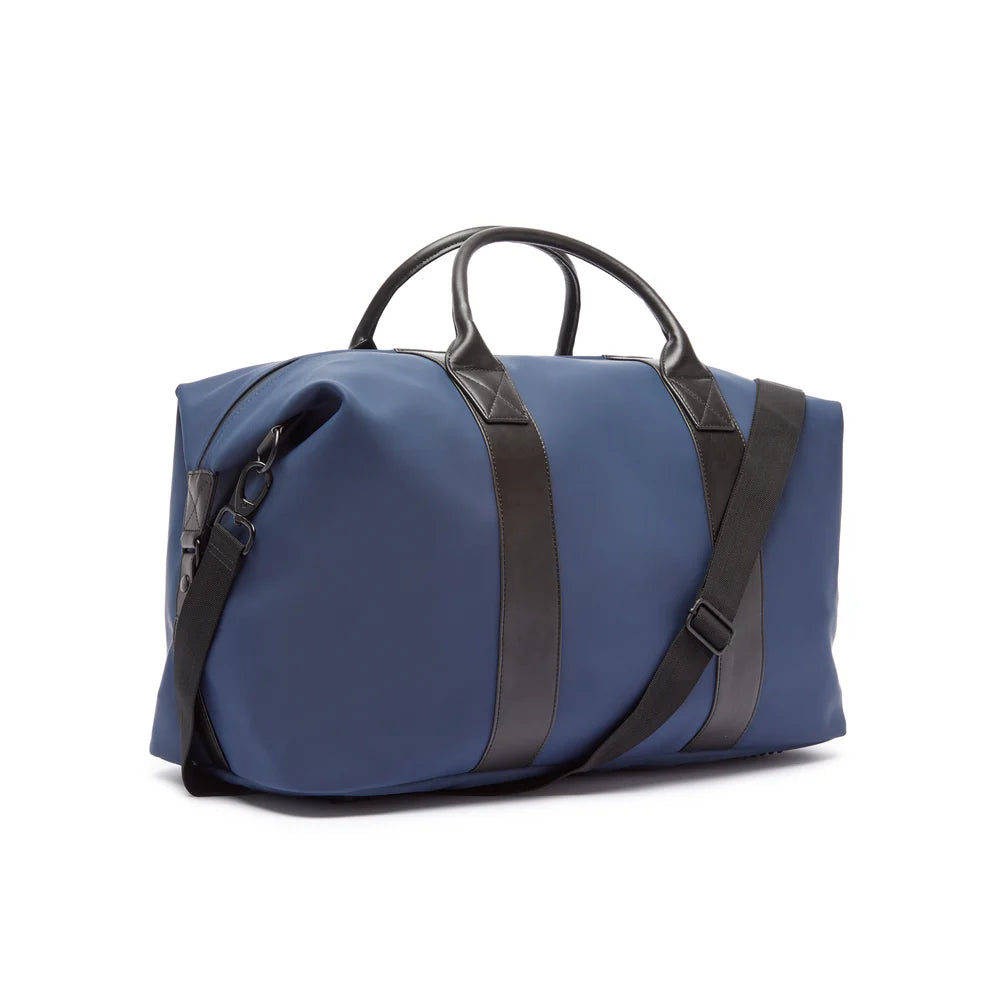Blue duffel bag with black straps on a white background