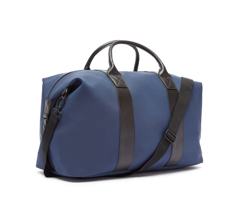 Blue duffel bag with black straps on a white background