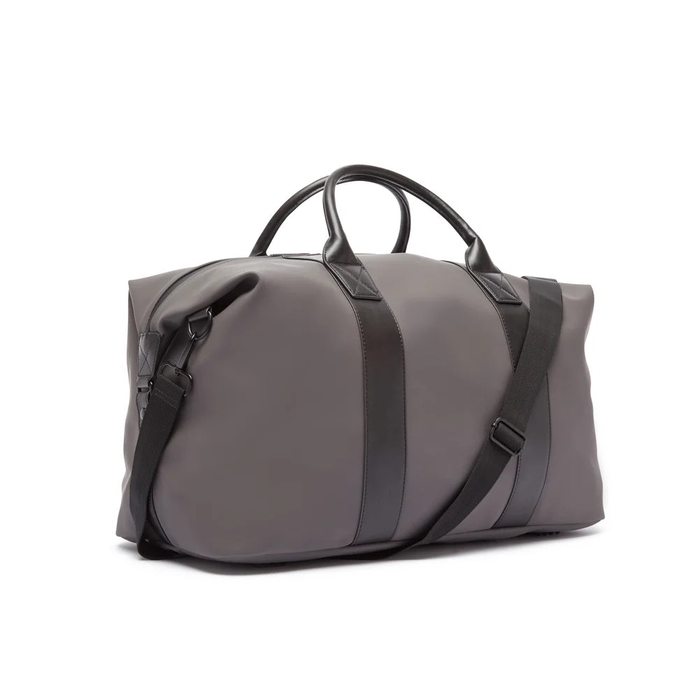 Gray duffel bag with black straps on a white background