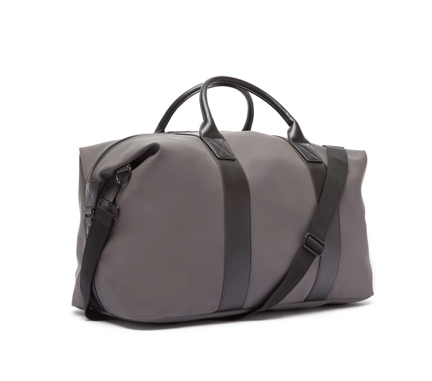 Gray duffel bag with black straps on a white background