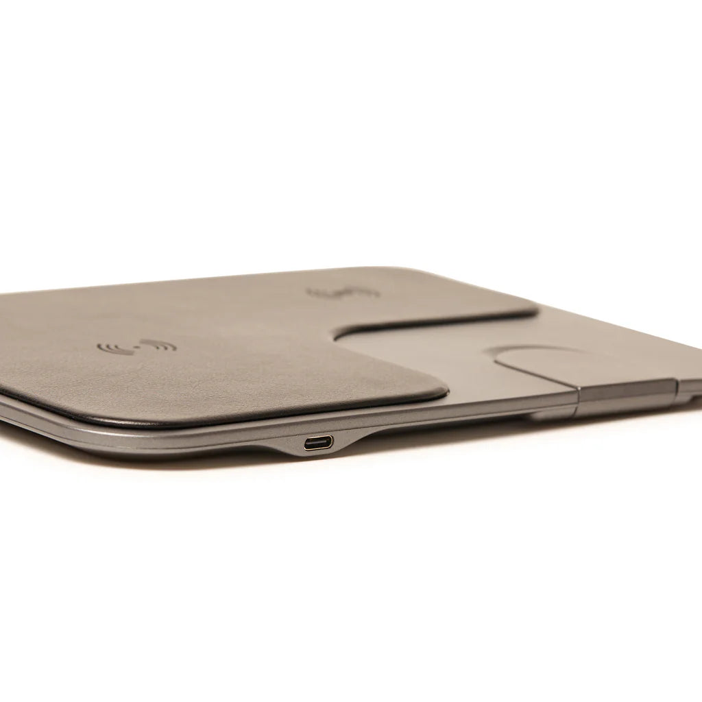 Wireless charging pad with a USB-C port on a white background