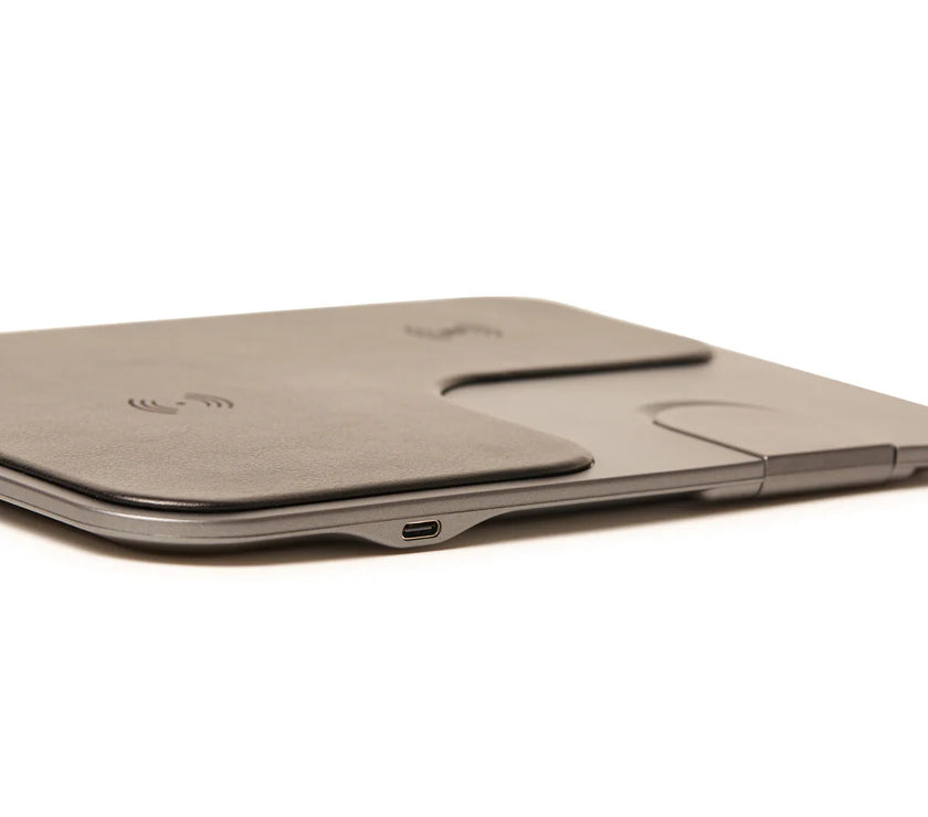 Wireless charging pad with a USB-C port on a white background