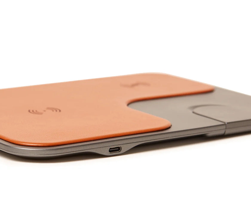 Wireless charging pad with USB-C port on a white background