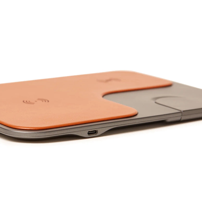 Wireless charging pad with USB-C port on a white background