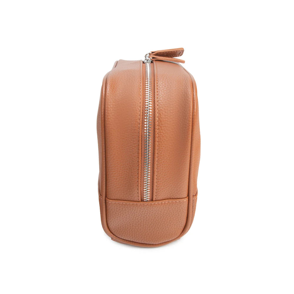 Tan leather toiletry bag with a zipper on a white background