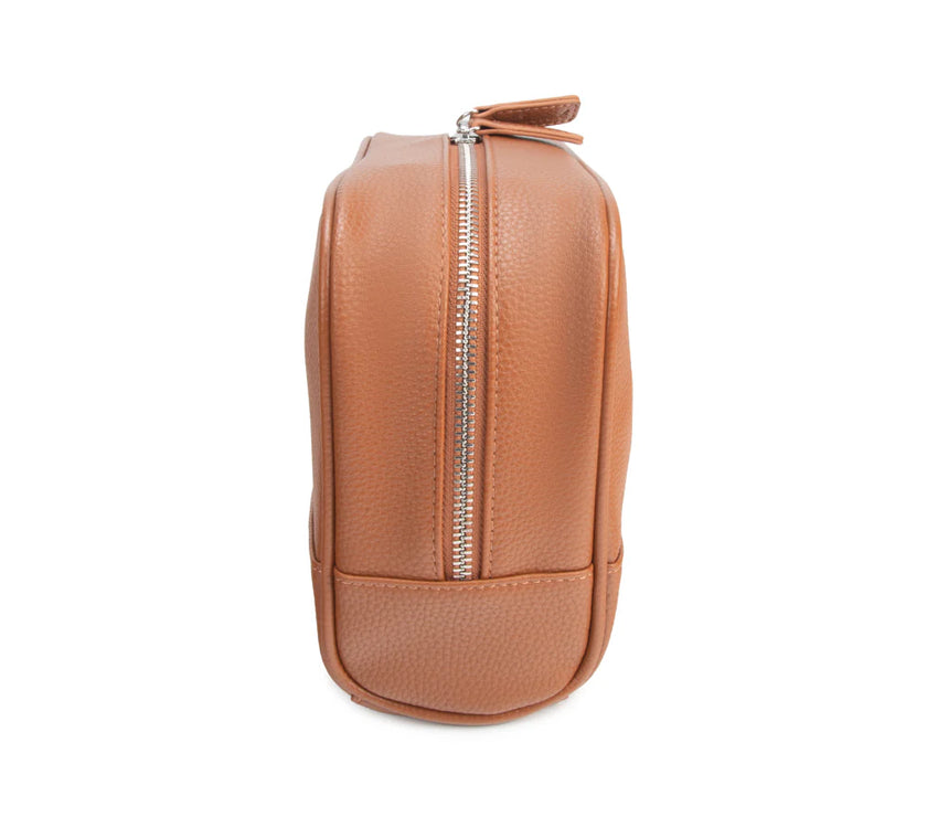 Tan leather toiletry bag with a zipper on a white background