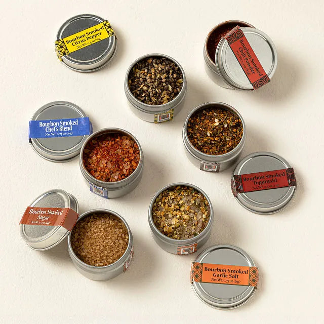 Collection of Bourbon Smoked Spice Tins on a light background