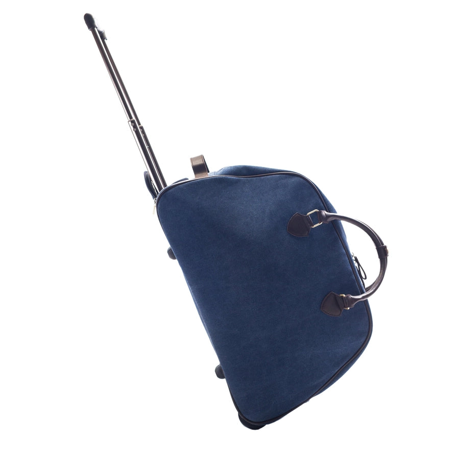 A blue Trolley Rolling Duffel with the handle extended to show its rolling ability.