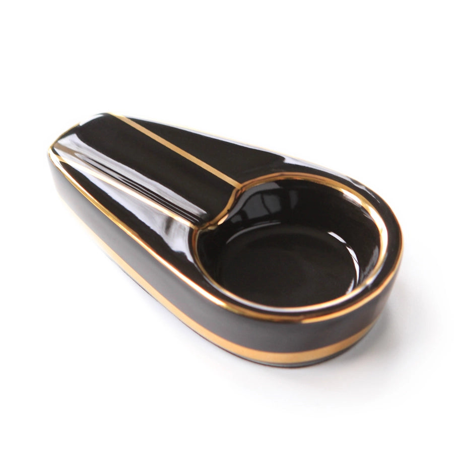 A premium brown and gold single cigar ashtray.