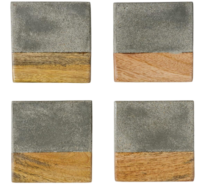 Four square coasters with a two-tone design of gray cement and wood on a white background.