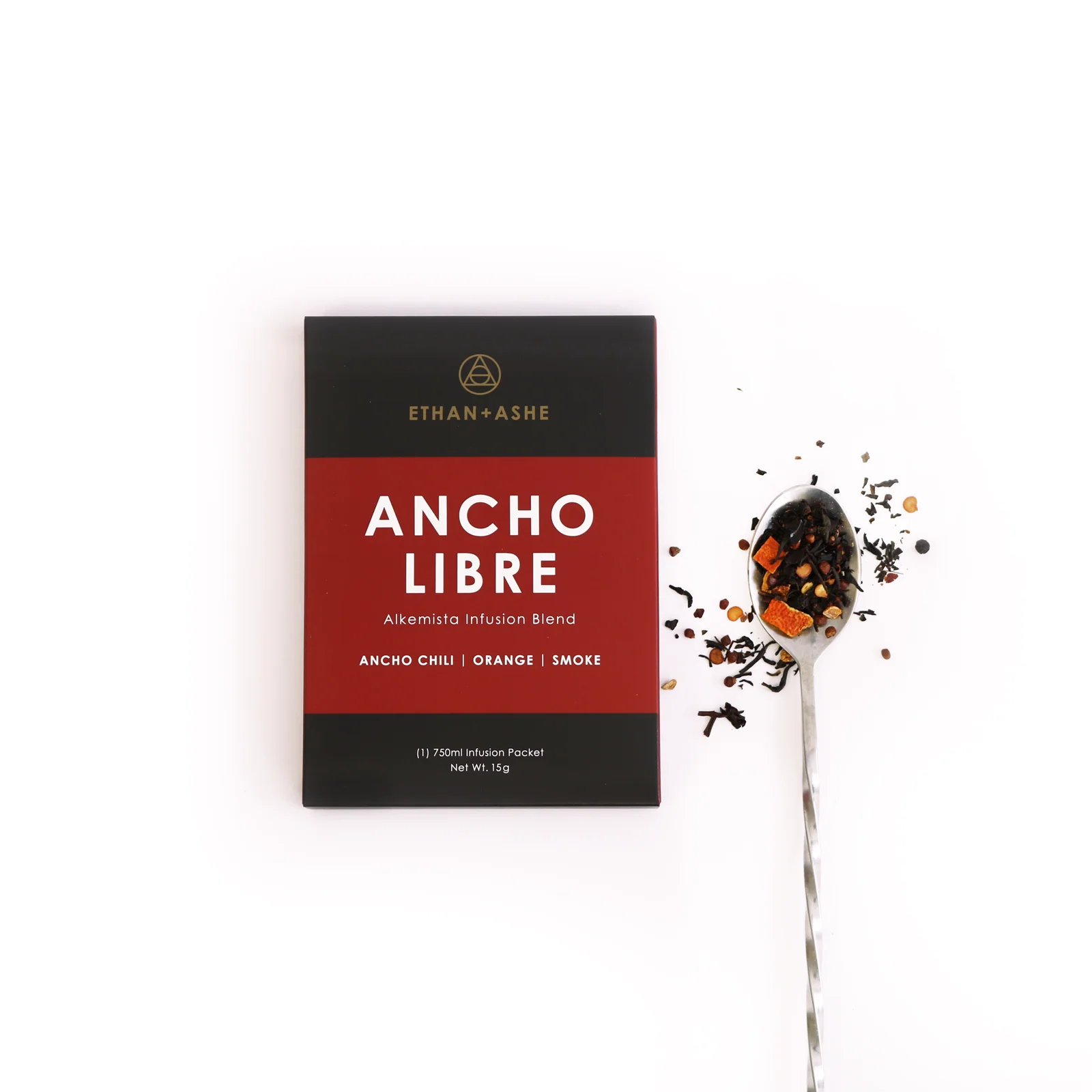 Ethan Ashe Ancho Libre tea package with a spoonful of tea leaves on a white background