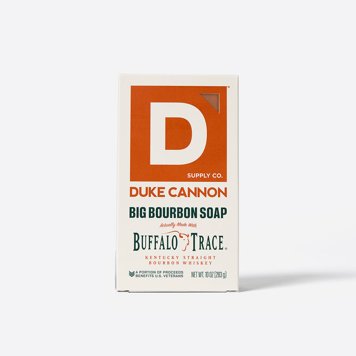 A Duke Cannon Supply Co. package for Big Bourbon Soap bar, and text indicating it is a big bourbon soap with bourbon from Buffalo Trace Distillery.