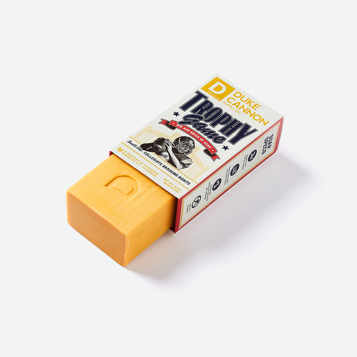 A bar of soap inside its package that has 'Duke Cannon Trophy Game' on the box
