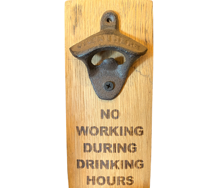 Wooden wall-mounted bottle opener with 'No Working During Drinking Hours' text on a white background