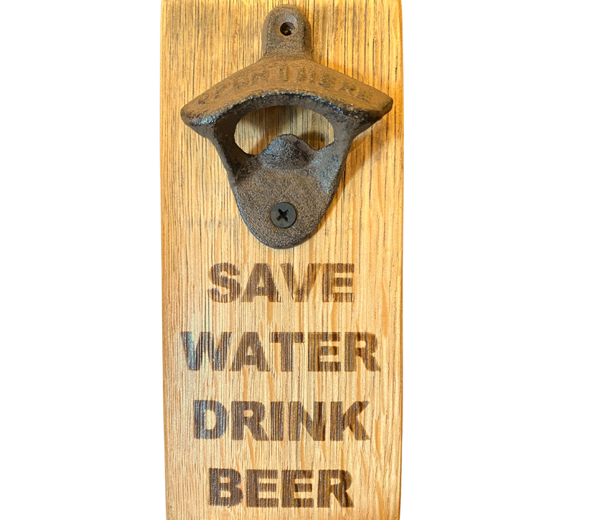 A barrel stave fashioned into a bottle opener with the words "save water drink beer" on it.