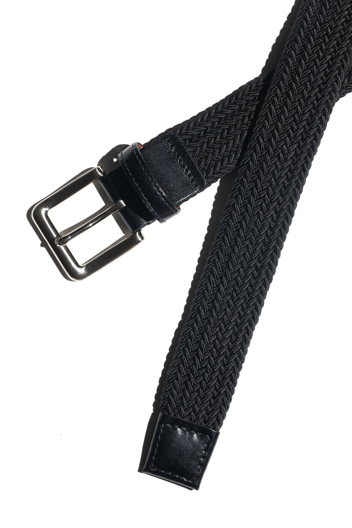 A black woven stretch belt with a traditional buckle and nickel finish, displayed against a white background.