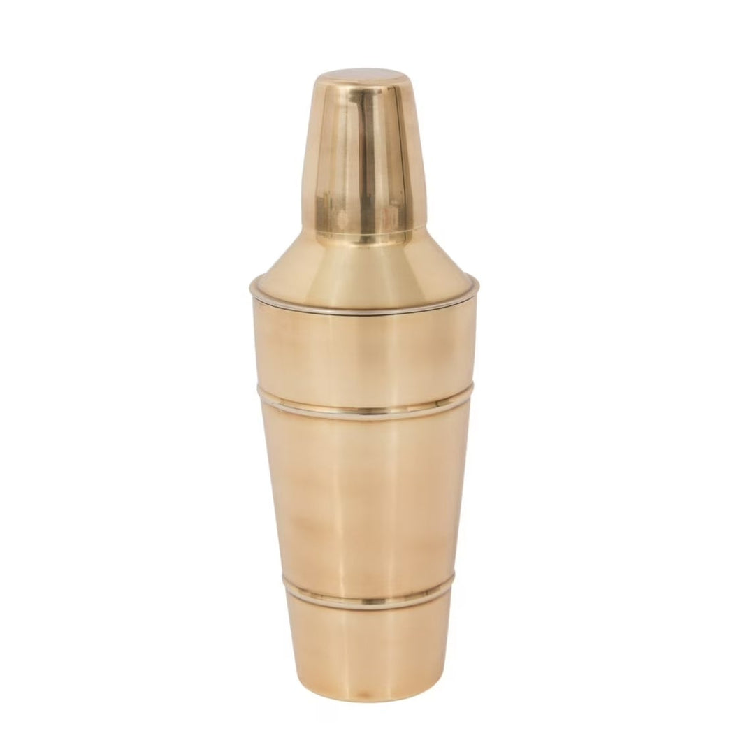 Brass finished stainless steel cocktail shaker on a white background