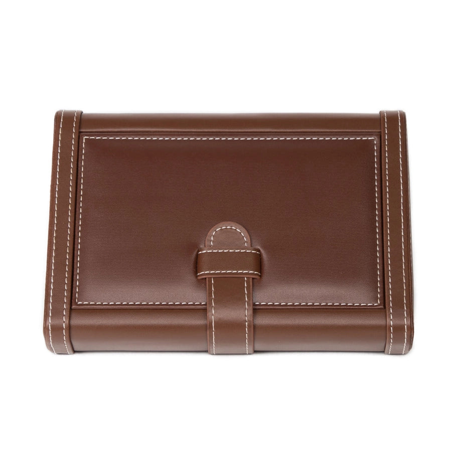 A leather wrapped humidor with white stitching on a white background.