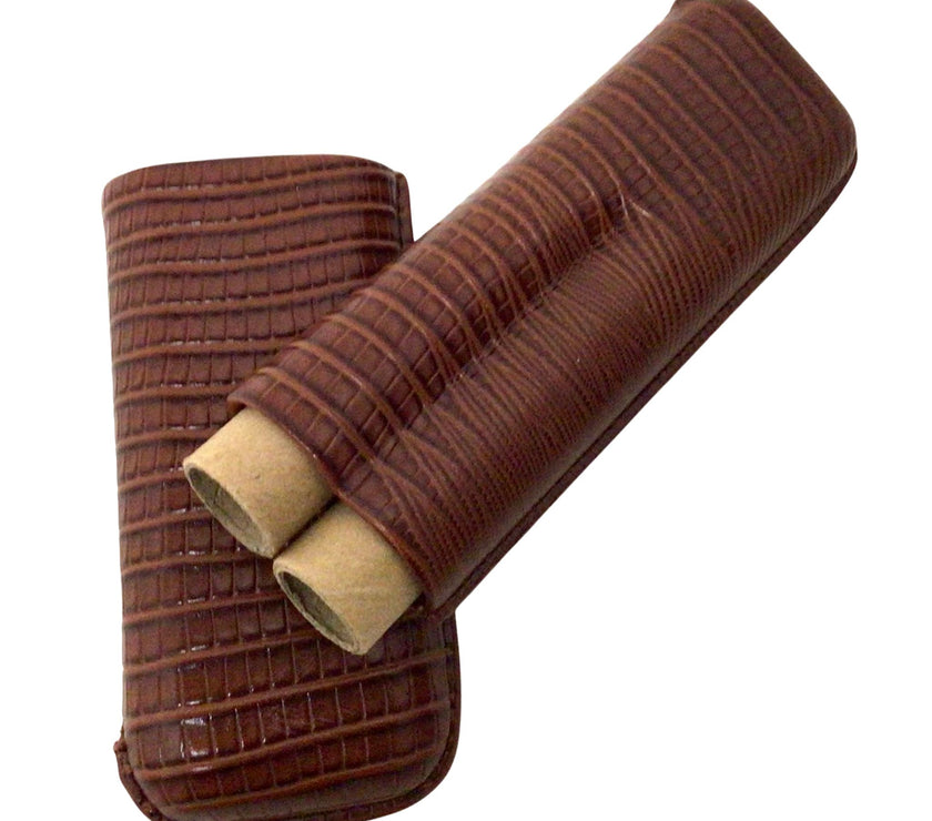 A brown cigar holder with lizard pattern and made of genuine leather, holding two items mimicking cigars.