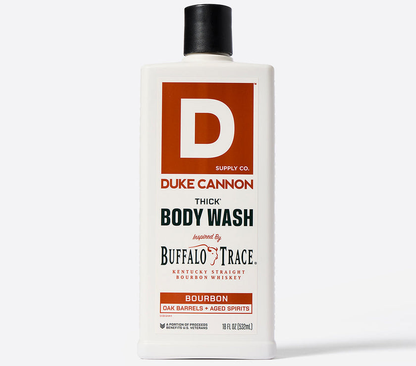 A bottle of Duke Cannon THICK Body Wash with the label indicating it is scented with Buffalo Trace bourbon.