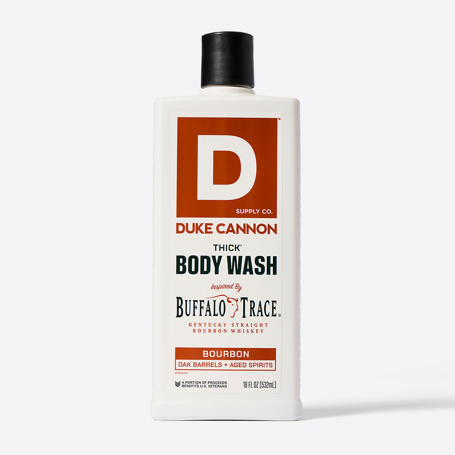 A bottle of Duke Cannon THICK Body Wash with the label indicating it is scented with Buffalo Trace bourbon.