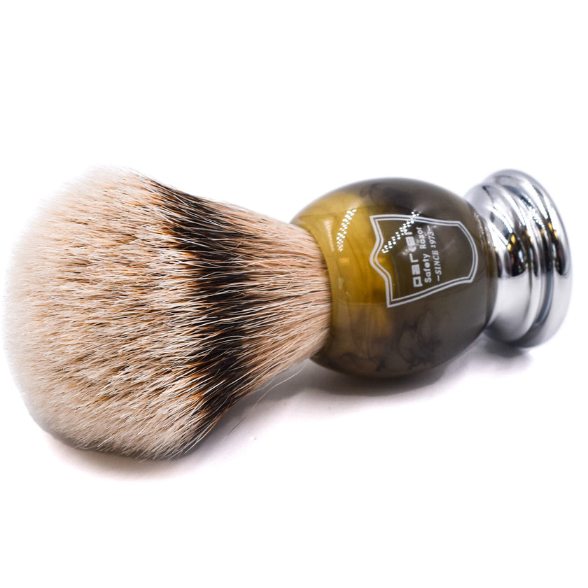Shaving brush with brown faux horn handle and silver ferrule on a white background