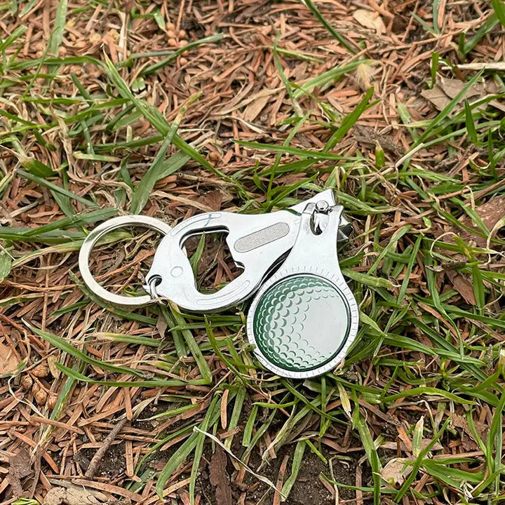 Keychain with a golf ball design on grass