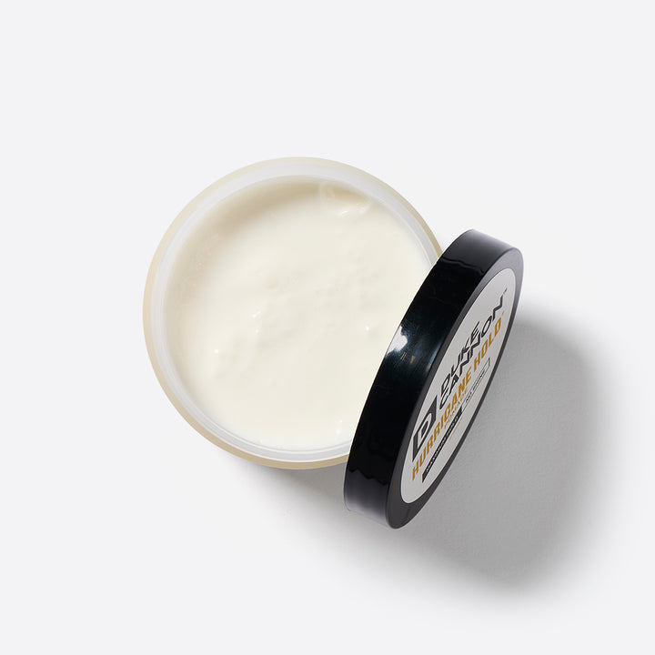 An open container of Duke Cannon Hurricane Pomade