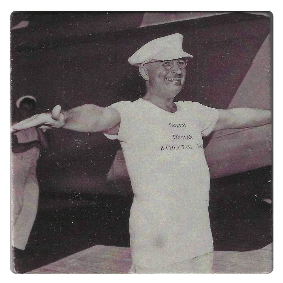 Vintage photograph of Harry Truman  in a white outfit with 'Coash Truman Athletic Club' text, standing with arms outstretched.