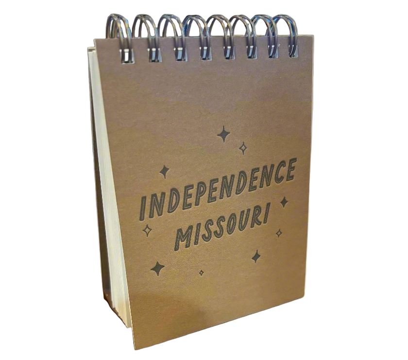 Small spiral-bound notebook with 'Independence Missouri' text on a white background
